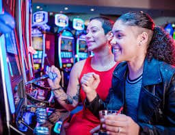 73 erek live dealer studio showing multiple blackjack and roulette tables in operation
